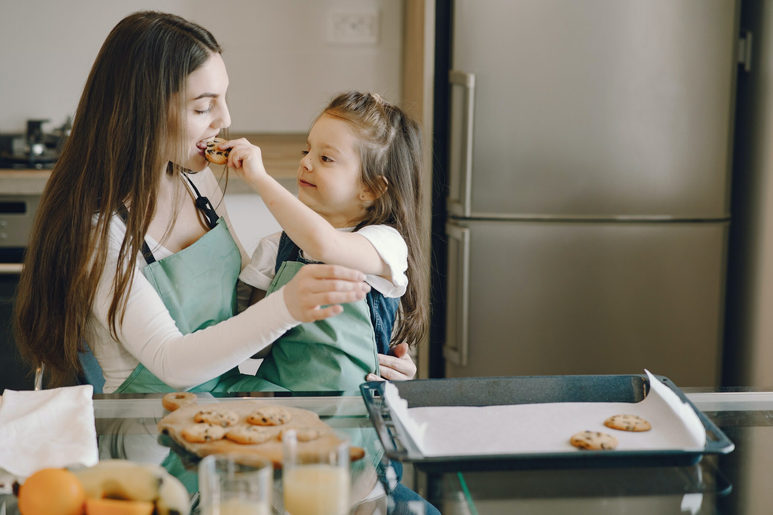 woman modeling intuitive eating with her young daughter