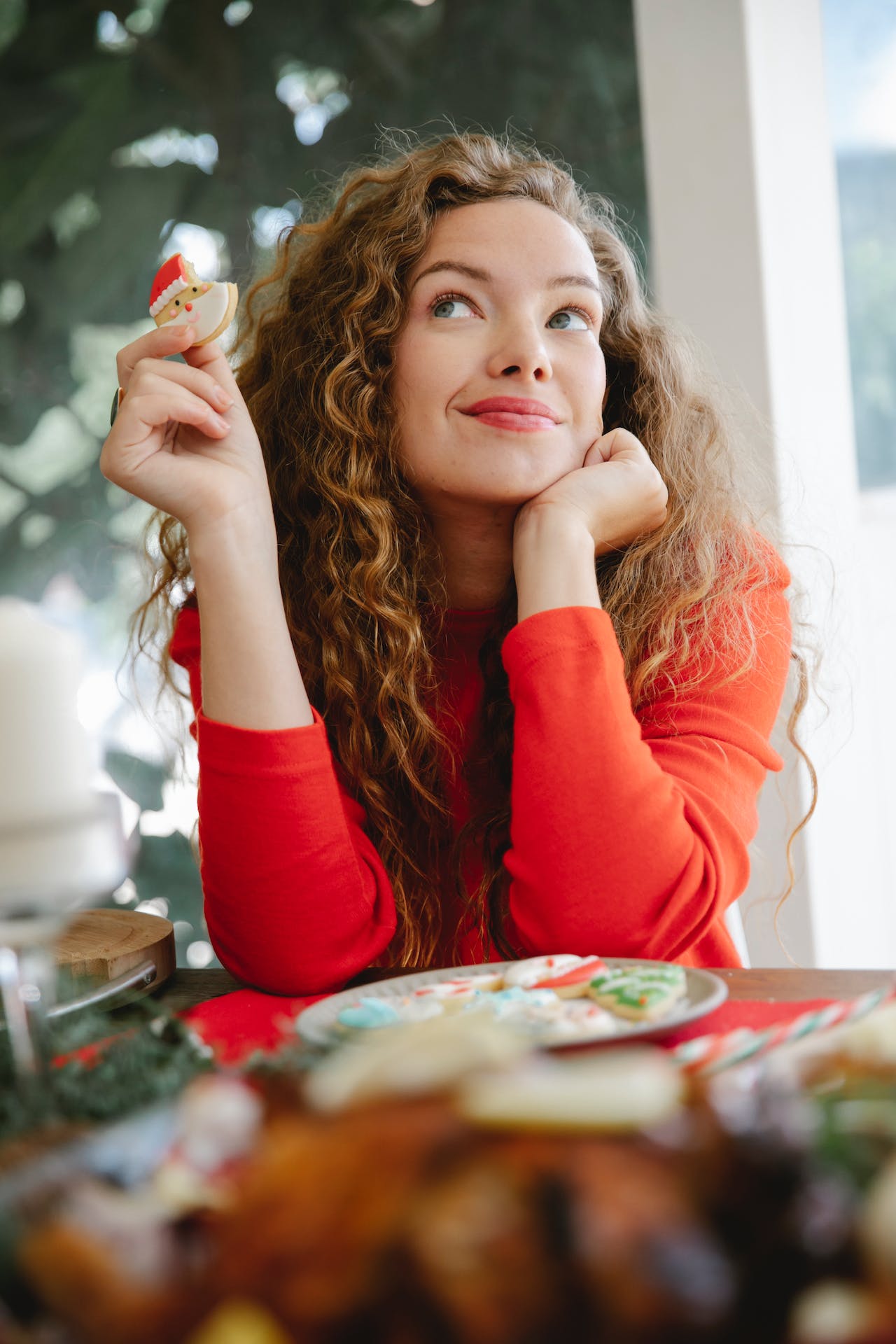 woman using the hunger scale while eating christmas cookies